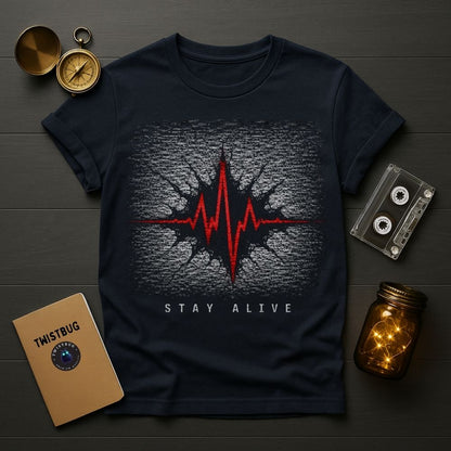 Navy blue t-shirt with red and white graphic design on a wooden surface with vintage items.