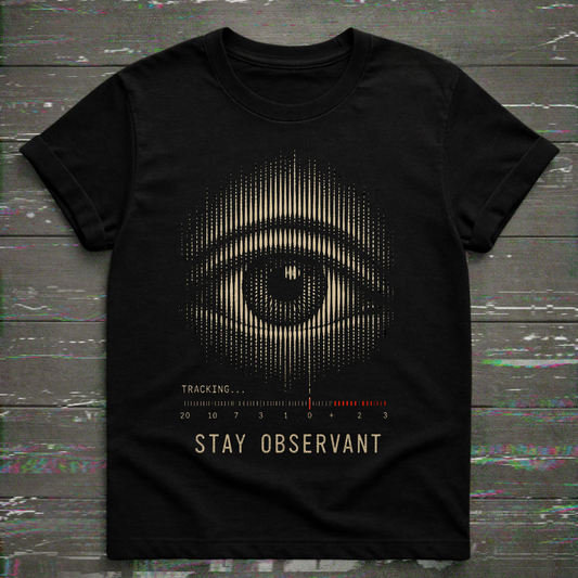 A black short-sleeve t-shirt with a graphic print of a stylized eye made of vertical dots, with the text 'TRACKING.