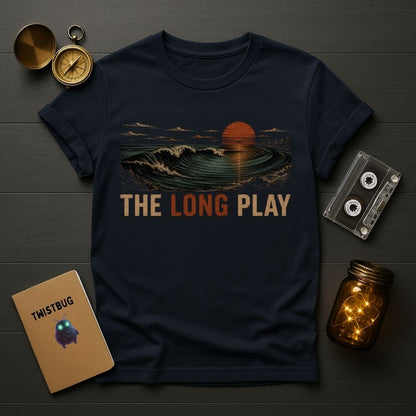 Navy blue t-shirt with 'The Long Play' design on a wooden surface with vintage items.