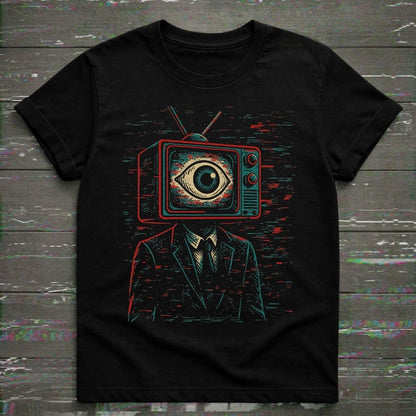 Black t-shirt featuring a vintage CRT television-headed figure with a large eye on the screen surrounded by analog static and glitch textures.
