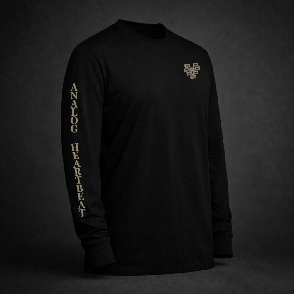 Black long sleeve t-shirt with pixelated heart chest graphic and “Analog Heartbeat” sleeve print in vintage bone color