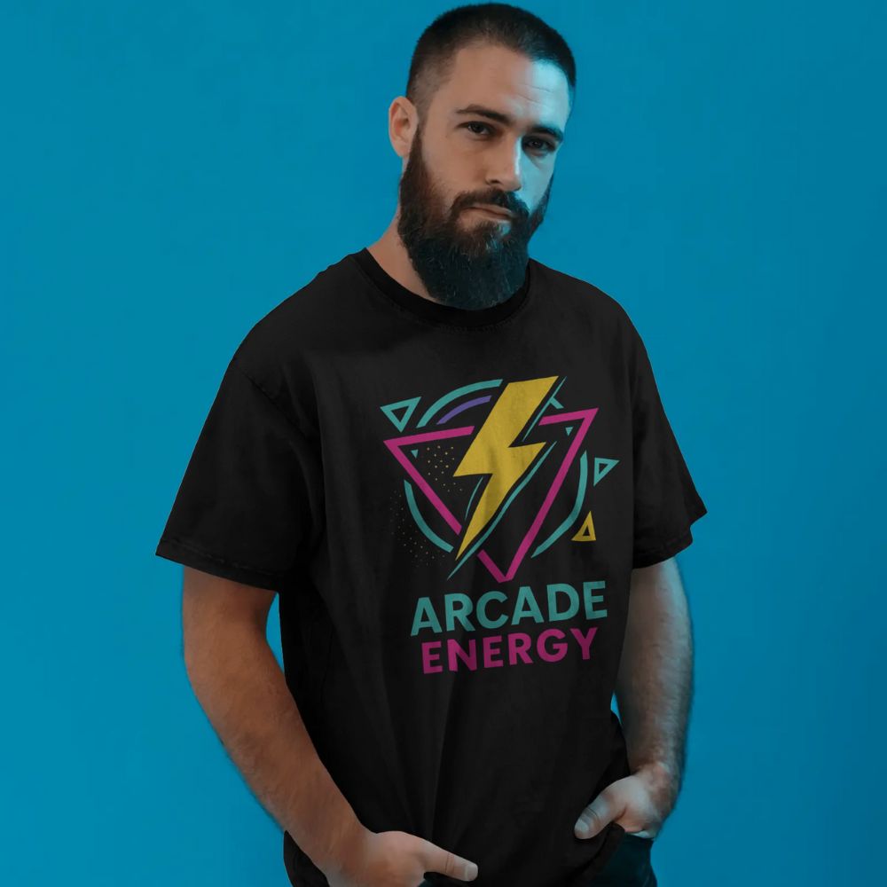Male model wearing black Arcade Energy T-shirt with neon retro lightning bolt graphic, retrofuturistic blue studio backdrop, Twistbug apparel