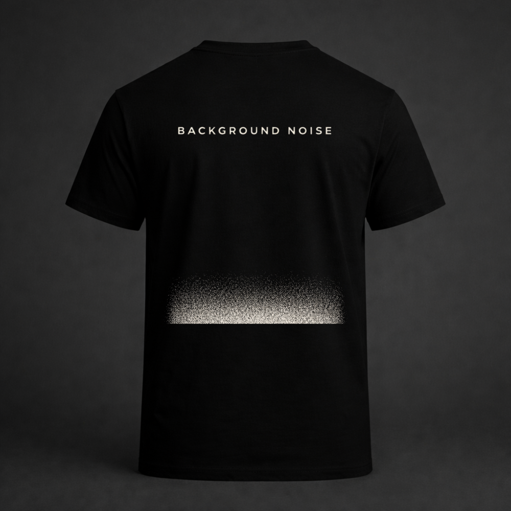 Black graphic t-shirt with “Background Noise” text and static fade design on back
Minimal streetwear tee featuring abstract static gradient print
Twistbug Signal Series black shirt with background noise concept
