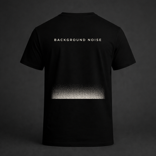 Black graphic t-shirt with “Background Noise” text and static fade design on back
Minimal streetwear tee featuring abstract static gradient print
Twistbug Signal Series black shirt with background noise concept