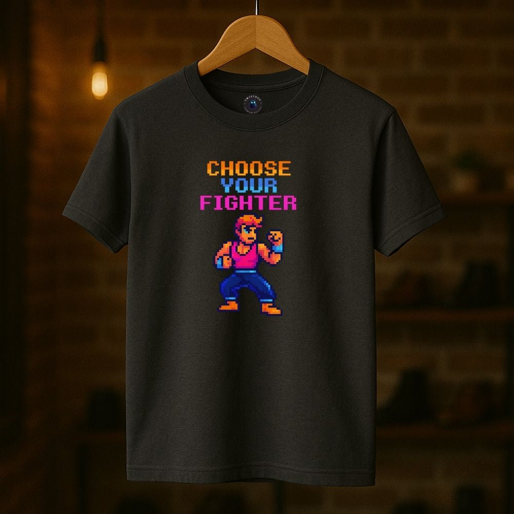 Charcoal “Choose Your Fighter” T-shirt on hanger in cozy studio setting, pixel art fighter, gaming nostalgia.