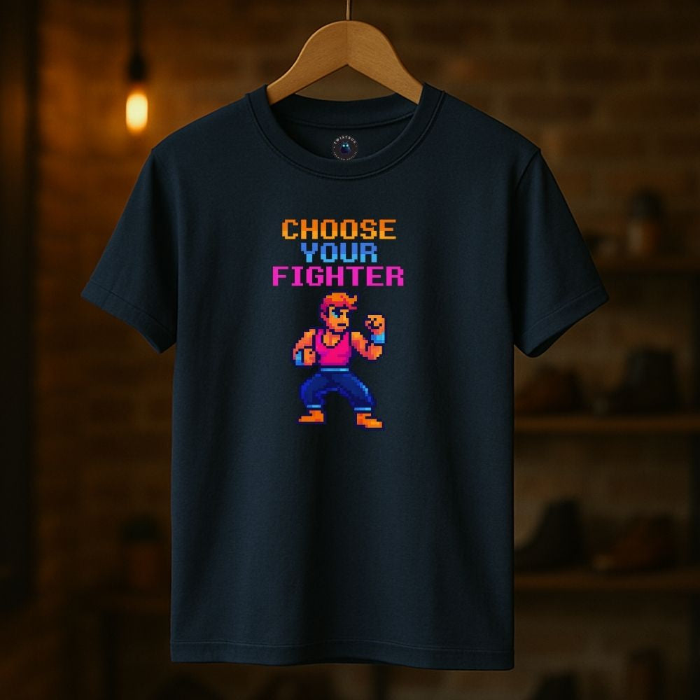 Navy “Choose Your Fighter” T-shirt hanging against warm blurred background, vintage gamer aesthetic.