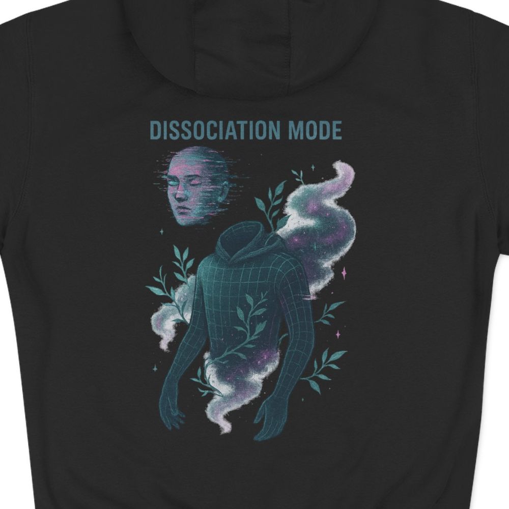 Close-up of the Dissociation Mode hoodie back graphic, surreal floating figure with cosmic smoke and teal leaves on black fabric