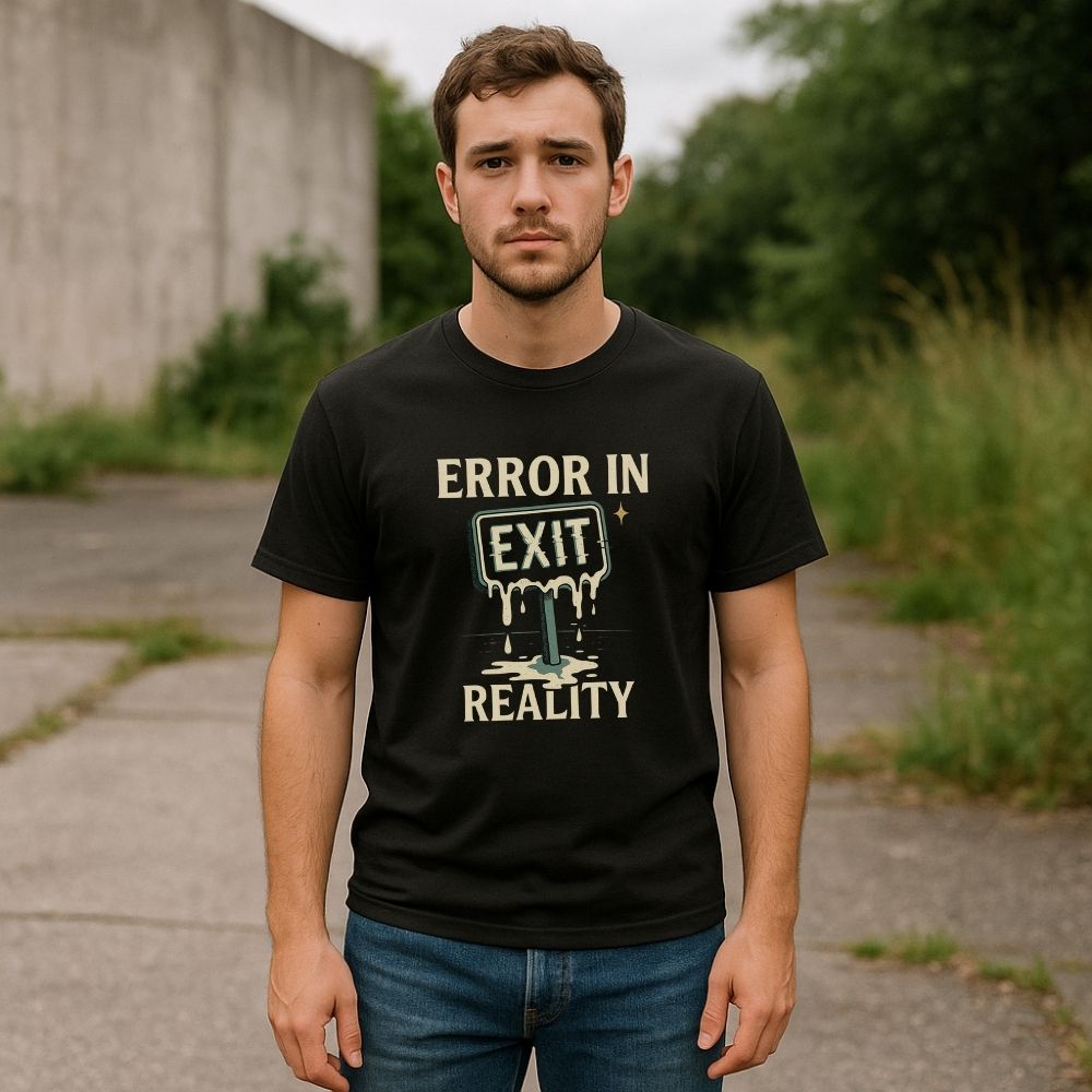 Man wearing Twistbug black t-shirt with the phrase ‘Error in Exit Reality’ and a melting exit sign graphic, standing outside on a cloudy day