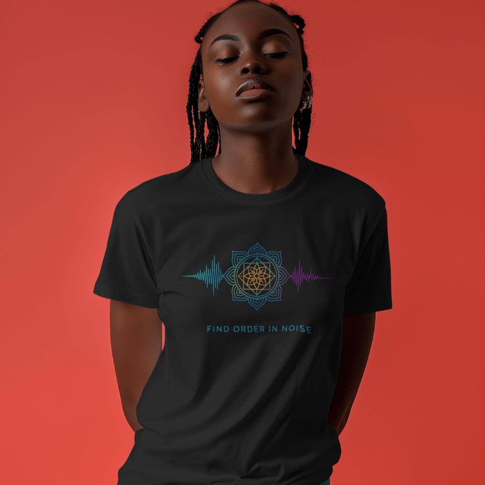 Woman wearing black “Find Order in Noise” Twistbug T-shirt with geometric mandala and soundwave design, red backdrop.