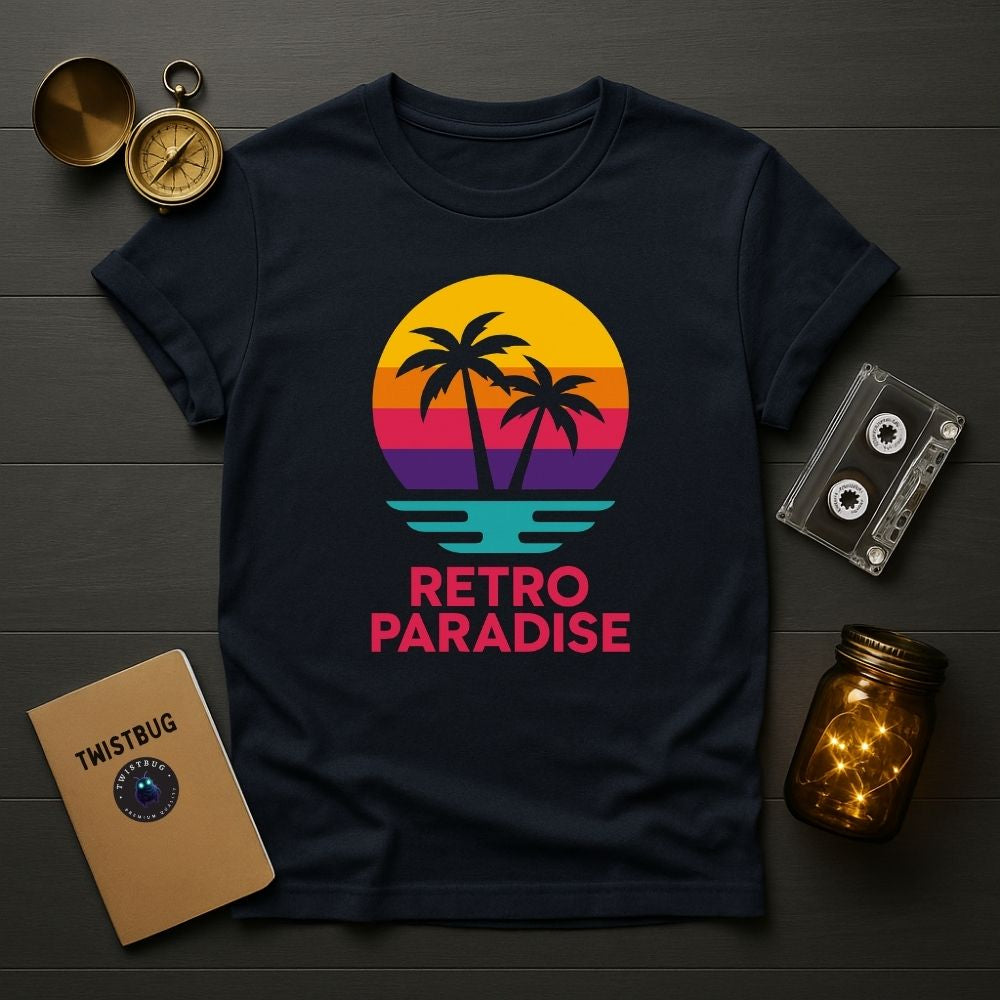 Flatlay of navy Retro Paradise T-shirt with bold retro sunset palm tree graphic, cassette tape and notebook props, Twistbug apparel