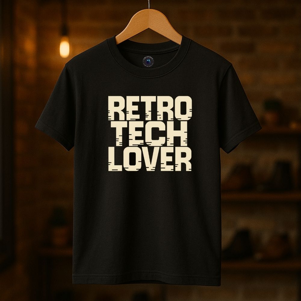 Black Twistbug t-shirt on hanger showing “Retro Tech Lover” print, boutique lighting background.