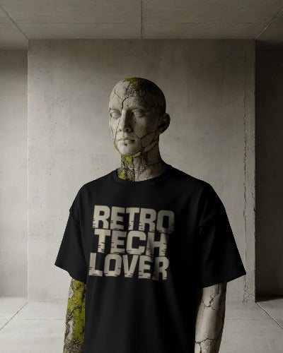 Black Twistbug T-shirt reading ‘Retro Tech Lover’ displayed on a surreal stone-textured mannequin in a concrete minimalist room.