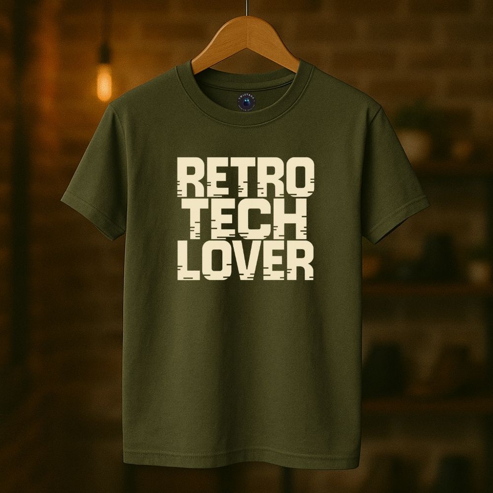 Military green Twistbug t-shirt on hanger featuring “Retro Tech Lover” lettering, boutique warm lighting.