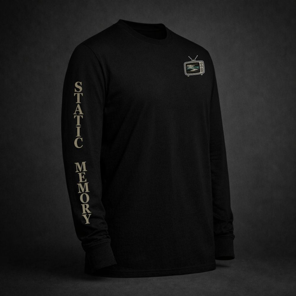 Black long sleeve t-shirt featuring a glitchy retro television chest graphic and “Static Memory” printed down the sleeve