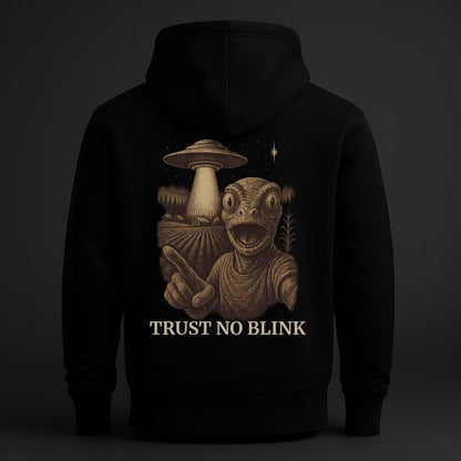 Back view of black hoodie with surreal pointing figure and UFO graphic, Trust No Blink design